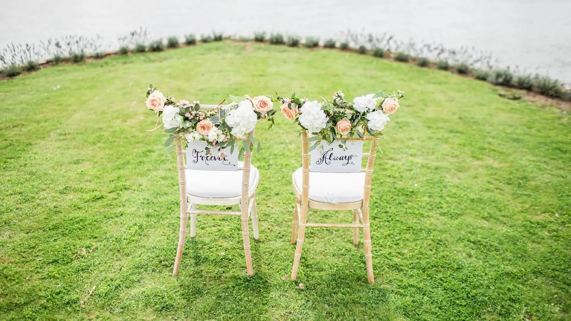 Loose seasonal bouquet with blush and ivory blooms and garden foliage.
